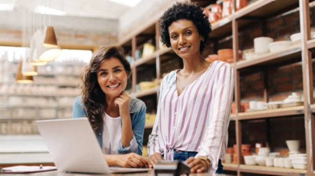Two women working their small business.