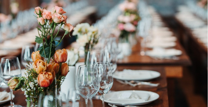Flowers and Dinnerare Setting on Table at Fancy Event