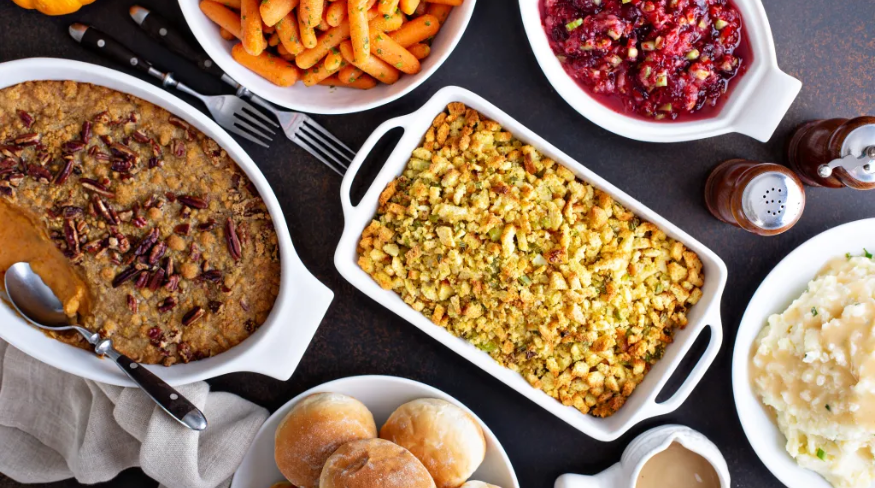 Thanksgiving assortment of food spread out on the table.