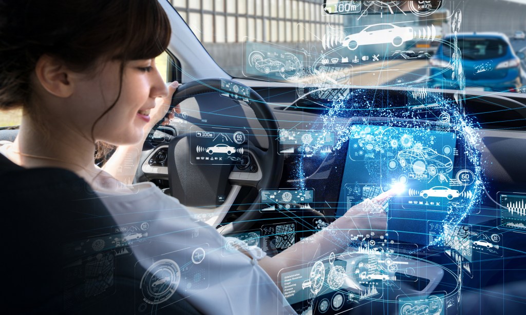 3D visual of a women setting up driverless vehicle settings on the cars touch screen.