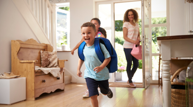 Kids running back home after school.