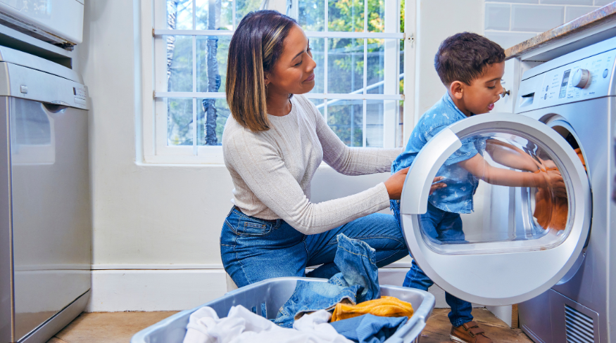 Mother and son doing laundry together.