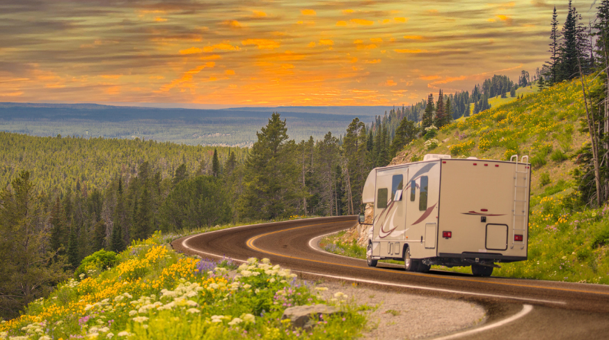 RV driving through the mountains.